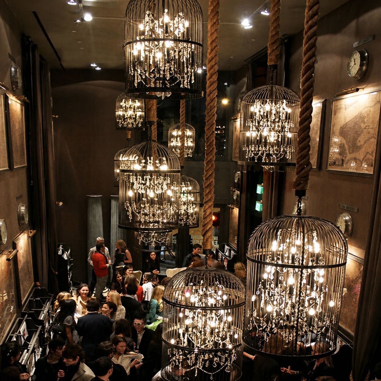 Modern black crystal chandelier lighting up exhibition hall at night